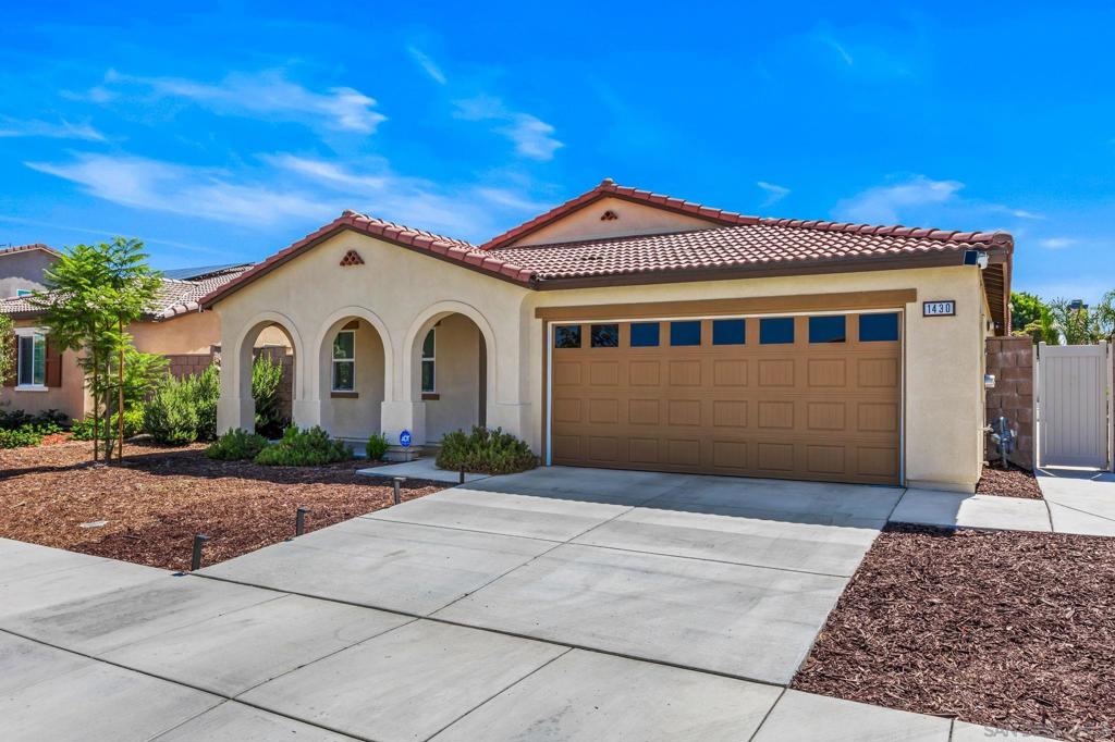 Welcome to this modern, sun-filled one-story gem in Hemet’s desirable 92543 community. Built in 2023, this beautifully designed single-level home offers approximately 1,897 sq?ft of open and airy living space on a generous 6,155?sq?ft lot, featuring 4 bedrooms and 3 bathrooms—perfect for families or entertaining guests. Step inside to discover the stylish luxury plank flooring throughout, offering the warmth of natural wood with pet-safe, water-resistant durability. The expansive great room seamlessly flows into the kitchen, where custom white cabinetry, granite countertops, and stainless-steel appliances elevate everyday meals and gatherings to a chef’s delight. Retreat to the expansive primary suite, complete with dual sinks, a spacious walk-in closet, and direct access to the outdoor covered patio—ideal for morning coffee or evening relaxation. The three additional bedrooms are generously sized and flexible for guests, homework, or hobbies. Outside, the covered patio beckons for al fresco dining and entertaining, with space to spare for outdoor activities or garden styling. The low-maintenance lot maximizes usability and invites seamless indoor-outdoor living. Located just minutes from Hemet schools, neighborhood parks, and shopping centers, this home blends modern convenience with community charm. Nearby schools include McSweeny Elementary, Diamond Valley Middle, and West Valley High—within about 0.5 to 1.6 miles and served by the Hemet Unified School District. Don’t miss your opportunity to experience the perfect blend of style, functionality, and location!!!