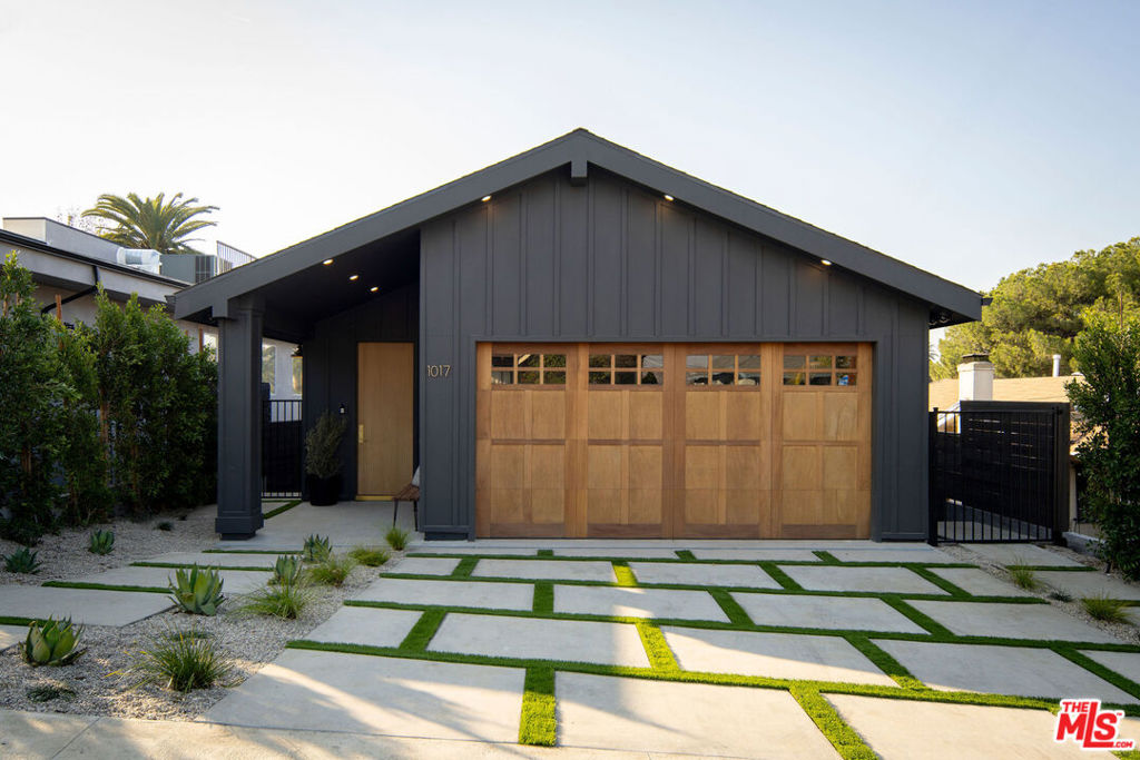 Perched atop a scenic hill with breathtaking views of the San Gabriel mountains, this residence embodies quiet luxury, blending form and function, a home designed not just to be lived in, but to be experienced. The curb appeal commands attention with striking board and batten architecture, rich wood tones, and lush greenery. Step inside and be captivated by the soaring clad-vaulted ceilings, grand open space with 8ft solid white oak doors, hardwood floors, and an abundance of natural light.