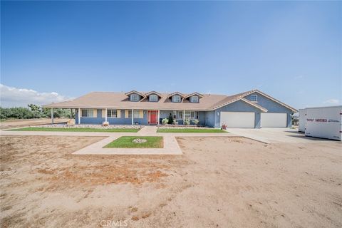 Photo of 10636 Larch Rd, Oak Hills, CA 92344 (MLS # HD26072050)