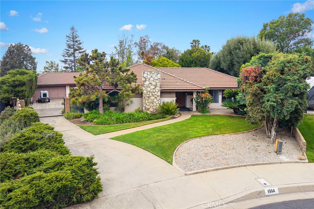 Welcome to this one original owner, delightful ranch home nestled in a highly sought-after Glendora Springs neighborhood north of Sierra Madre avenue with mountain views. Its a charming 2,269 sq. ft. traditional home featuring 4 bedrooms and 2 bathrooms, comfortably situated on a generous 17,643 sq. ft. lot—one of the four largest in the area. The luscious, gated, private yard with block walls has fruit trees and room to roam. A detached 3-car garage with workshop plus a carport measure 1055 sq. ft. perfect for a car buff or it can offer potential for conversion into an Additional Dwelling Unit (ADU). The large living room with stone fireplace and the formal dining room have wood flooring. Imagine all the books you can enjoy reading and store on the built in book cases in the vaulted ceiling family room which opens with a sliding door to the yard. The kitchen with a center island, although original to the house, is in good condition. the primary sun lit bedroom also has a sliding door opening to the back yard. The home provides a peaceful retreat with convenient access to shopping, dining, nature trails, and easy access to freeways and is all within a community that takes pride in its homes. Enjoy top-rated, award-winning Glendora schools, stunning mountain views, and a neighborhood filled with high-quality homes, making this an exceptional place to call home. Anyone seeking a tranquil yet connected lifestyle will enjoy this home which offers the best of both worlds. While it requires some loving updates, these improvements will allow the new owner to tailor the home to their taste.