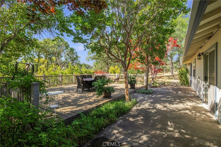 10-ACRES WITH AMAZING 3-BED, 2-BATH HOMESTEAD!! PRIVATE 10-acre spread of FULLY FENCED and CROSS-FENCED land with LUSH GRAZING PASTURES, EXCELLENT GARDEN AREA.... this beautifully upgraded home offers the perfect blend of comfort, function, and natural beauty. Enjoy tranquil mornings overlooking a SEASONAL POND a YEAR-ROUND AGRICULTURAL CANAL that bring life and charm to the landscape. Boasting 1,658 square feet, the home features an open floor plan with new flooring throughout, fresh Benjamin Moore interior paint, and a spacious living and dining area. Sliding glass doors lead to a large composite deck surrounded by colorful, ever-changing gardens — from roses and Japanese maples to wisteria and citrus trees — and an outdoor shower tucked within a peaceful backyard sanctuary.  The kitchen includes a brand-new range/stove, while all bedrooms are outfitted with new carpet, doors, hardware, ceiling fans, and recessed lighting. A newly built bay window seat in the master suite adds a perfect nook for reading or relaxing, and the bathrooms now feature new toilets, a walk-in shower, and updated finishes. The attic has been freshly insulated for comfort and efficiency, and nearly all windows have been replaced with new fire-resistant models and elegant trim.  A two-car garage, indoor laundry, walk-in closets, and ample space for animals enhance the property’s appeal. Located just across from the iconic Lodestar Farms mansion, follow Walter Blume Road to the very end to discover this peaceful retreat with peekaboo views of the valley, stunning sunsets, sparkling stars, and just a hint of city lights at night. With privacy, practicality, and proximity — only 5 minutes to town or the highway — this countryside gem is truly one-of-a-kind. Schedule your private showing today before it’s gone!