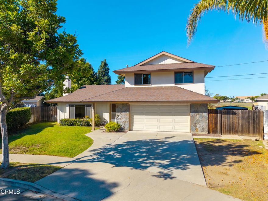 Nestled at the end of a cul-de-sac in Central Camarillo. Possibilities abound with this 4 bedroom, 2 bath home offering a spacious, private, park-like backyard featuring fruit trees and no residential properties behind - ideal for relaxation and outdoor enjoyment. Sizable living room with fireplace is filled with natural light from a large picture window, perfect for gatherings. Generous kitchen overlooks the backyard, providing a 5-burner gas range, built-in microwave, and stainless-steel dishwasher. Adjacent dining area opens directly to the backyard patio, creating a seamless indoor/outdoor living and entertaining experience. Convenient downstairs primary ensuite and three additional bedrooms with full bath located upstairs. This is an ideal location near parks, schools, shopping, & dining, with easy access to the 101 freeway. This property has significant potential -Don't miss this opportunity!