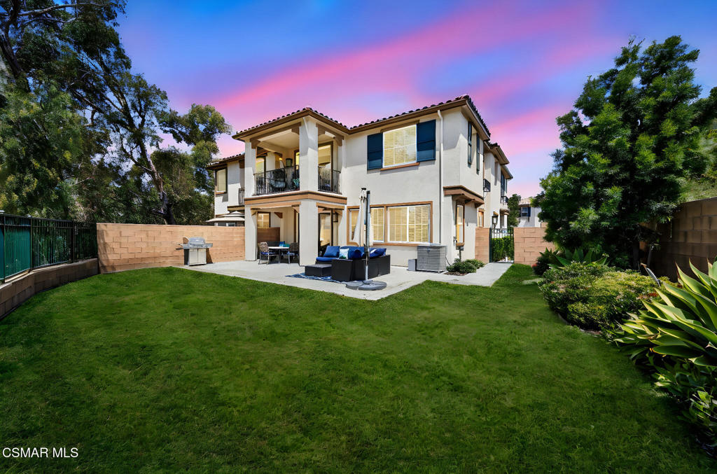 Welcome to 274 Morro Way, Unit 1, nestled in the tranquil and highly desired community of Wood Ranch in Simi Valley. This newer build townhouse, constructed in 2018, is a rare find because of the spacious yard with stunning mountain views.Step inside this beautifully designed home where you'll find a generous 2,581 square feet of living space. 4 bedrooms plus an enclosed office space or rec room provide options for those working from home.The primary suite opens up to a private balcony, inviting you to unwind and enjoy serene mountain views. Along with the primary bedroom upstairs, you will find 2 additional bedrooms plus the additional office/rec room that was created by enclosing the loft. The laundry room is also conveniently located upstairs. One additional bedroom can be found downstairs. The open floor plan seamlessly connects the living room, dining area, and kitchen, creating an inviting environment for entertaining guests. The oversized island is a chef's dream and also provides seating for quick meals. Large windows allow for ample natural light and the glass slider opens to the outdoors. Perhaps the most desirable feature is the large backyard, one of the few in the community, offering a private outdoor haven for gatherings, celebrations, or simply relaxing with a backdrop of breathtaking mountain views.This townhouse comes complete with a 2-car garage along with plenty of community parking spaces for guests. The garage is wired to support up to two Level 2 charging stations for EVs (see private notes for details). The Pinnacle community amenities include a pool and spa for relaxation and fun. You also have access to Wood Ranch amenities including playgrounds, tennis courts, the members-only Wood Ranch golf course, basketball courts and soccer fields.Located near parks, hiking trails, and shopping, Pinnacle at Wood Ranch offers a peaceful retreat ready to welcome you home.