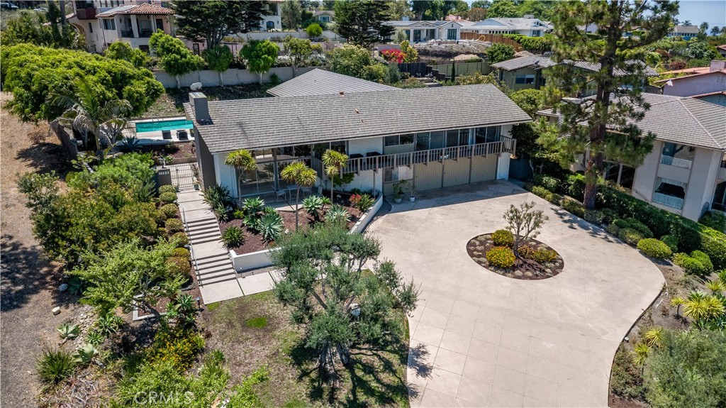 Coastal estates with sweeping views of coastline, ocean, white waters, and city lights from Redondo Beach to Malibu. Situated across bluff parklands for you to enjoying sunset, sailboats, and sparkling night lights from all major rooms. Pool and decks with great coastline view!
Kitchen with granite countertops, center island, built-in 66" Viking refrigerator, 2 sinks and custom cabinets.
Travertine flooring in kitchen and family room. Hardwood floors in every bedroom. Remodeled bath. All bedrooms have access to pool and balconies. Extra large 3-car garage. Large laundry room with plenty of storage cabinets.
Close proximity to award-winning schools: PV High, PV Intermediate, Lunada Bay Elementary.