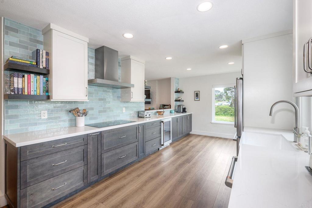 Beautiful Solana Beach home with recent interior remodel completed. Fantastic floor plan consisting of three bedrooms upstairs including a spacious primary suite plus one bedroom/office and bathroom on the main level. Enjoy soaring vaulted ceilings, an extra wide staircase and wood flooring in this sunlit home. The main level consists of a living room, formal dining area and comfortable family room with a fireplace. Updated gourmet chef's kitchen, beverage fridge, induction stove cooktop, extra kitchen storage and a Zip hydro faucet for instant boiling, chilled & cold sparkling water. This light and bright home has energy efficient windows and sliding doors. Nature abounds in the sunny garden with eco-friendly landscaping, updated hardscape, a fenced backyard and a pet safe screen enclosed catio. West facing sunset views and ocean breezes delight. House is located on a coveted cul-de-sac street. Minutes to the Del Mar Racetrack, pristine beaches, dining, and shopping. Nearby San Dieguito Park, Lomas Santa Fe County Club, schools, walking/hiking trails, restaurants, Cedros Design District and Fletcher Cove. A rare opportunity to experience the Solana Beach lifestyle!!!