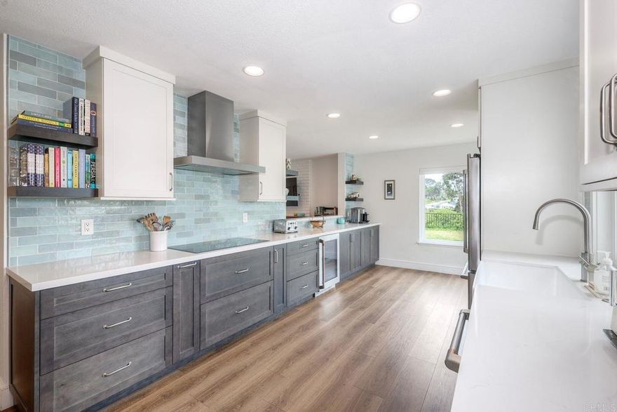 Beautiful Solana Beach home with recent interior remodel completed. Fantastic floor plan consisting of three bedrooms upstairs including a spacious primary suite plus one bedroom/office and bathroom on the main level. Enjoy soaring vaulted ceilings, an extra wide staircase and wood flooring in this sunlit home. The main level consists of a living room, formal dining area and comfortable family room with a fireplace. Updated gourmet chef's kitchen, beverage fridge, induction stove cooktop, extra kitchen storage and a Zip hydro faucet for instant boiling, chilled & cold sparkling water. This light and bright home has energy efficient windows and sliding doors. Nature abounds in the sunny garden with eco-friendly landscaping, updated hardscape, a fenced backyard and a pet safe screen enclosed catio.  West facing sunset views and ocean breezes delight. House is located on a coveted cul-de-sac street. Minutes to the Del Mar Racetrack, pristine beaches, dining, and shopping. Nearby San Dieguito Park, Lomas Santa Fe County Club, schools, walking/hiking trails, restaurants, Cedros Design District and Fletcher Cove. A rare opportunity to experience the Solana Beach lifestyle!!!