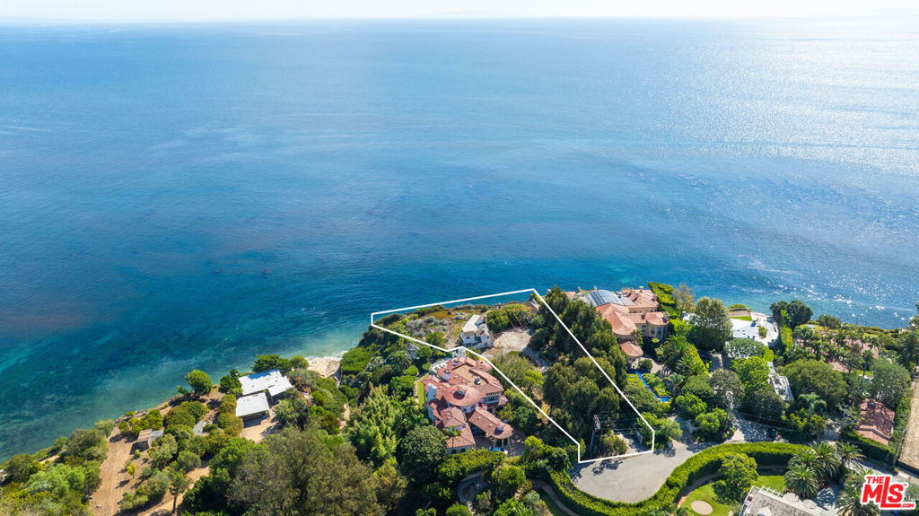 Located in Malibu and the highly desirable enclave of Pt Dume is May's Landing, a landmark development opportunity set at the end of a beautiful and lavish cul-de-sac on Cliffside Drive. Property recently received a Coastal Development Permit from the City of Malibu. This magnificent bluff site features over 1.4 acres with 237 feet of wrap-around ocean view frontage and just 50 steps to a private gate accessing Little Dume beach, the most exclusive beach in all of Malibu, home to world class surfing. Designed by renowned XTEN architecture is an impressive light filled modern designed estate containing a living space of approximately 8,632 SQFT, including four bedrooms, seven baths with a fitness and wellness floor. The grounds are gated and designed by Ground Studio Landscape Architecture featuring a tree lined driveway, beautiful outdoor entertaining areas and a handsome pool overlooking the ocean and the Queen's necklace at night. Geologically engineered and permitted piles have been installed along the bluff edge. What has taken over a decade to entitle will be delivered shovel ready and one of the most exciting opportunities in Malibu today.