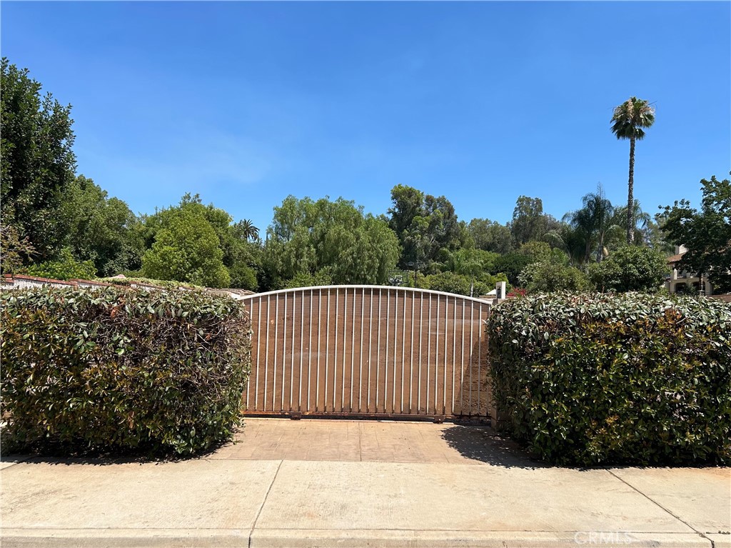 Available now is this amazing Residential vacant lot. Just under 15,000 sqft of perfect flat land to build your dream home on. This wonderful lot sits within this nicely established neighborhood with its beautiful foliage and treelined streets. Surrounded by beautiful homes and estates this piece of land is a very desired parcel. Already set up for success with its nice tan 6 foot high slumpstone walls and nice wrought iron entrance gate for security and privacy all together. Come take a look at this well manicured parcel of residential vacant land and you will feel right at home in this serene and peaceful neighborhood. So if you're looking for a place to grow family roots and make some dreams come true then this is the place for you. Don't hesitate or wait to long.