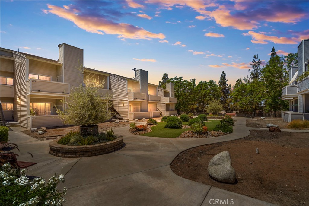 Welcome to this charming, move in ready, ground floor, single story condo, in well maintained, resort style, highly desirable Colony Park gated community in Azusa. It offers the perfect blend of both comfort and convenience. This spacious one-bedroom condo offers a thoughtfully designed layout, featuring a large bedroom with a walk-in closet and a full bathroom with a bathtub. The updated kitchen includes granite countertops, ample cabinetry, and is fully equipped with a stove, oven, dishwasher and a microwave. A convenient in-unit laundry closet with a stackable washer and dryer adds everyday convenience. Central HVAC provides year-round comfort. The open-concept dining and living area, accented with crown molding, flows seamlessly to a generously sized private patio, perfect for relaxing or entertaining. This condo includes a shared garage with a locked, spacious storage room, as well as an additional assigned parking space. Guest parking is also available. Located in the desirable Colony Park community, residents enjoy access to premium amenities, including two sparkling swimming pools, a whirlpool spa, a clubhouse, barbecue areas, playground, a lush greenbelt and a dog run. Ideally situated near Azusa Pacific University, Citrus College, and vibrant downtown Covina, the property also offers convenient access to the 210 and 605 freeways, Foothill Transit, the Metro Gold Line, and a wide range of nearby parks, shopping, dining, and entertainment options. Grab this rare opportunity to become the proud owner of this condo, your perfect place to relax, enjoy and make unforgettable memories.