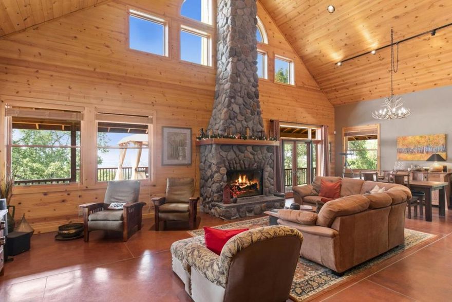 Wonderful private country property on 20 acres.  This fantastic property has plenty of spacious decks to enjoy the outstanding mountain and vineyard views.  The main house has cathedral ceilings and  a stunning 20 foot high stone fireplace.  The house features beautiful stained concrete floors, air conditioning and a great kitchen open to the living and dining area.  The property has a very private separate 450 square foot charming guest house and a separate beautiful 2 bedroom 750 square foot  hideaway house with private access.   On the property is a green house, a large fenced in vegetable and herb garden, storage barn, private well, bocci ball court and two carports with additional storage.  The houses and property have been lovingly cared for and are turn key.   The home has easy access off a paved road.  This country dream home is waiting for you just 25 minutes from the Carmel Valley Village and 45 minutes from Carmel by The Sea and the Monterey Airport.  The property is within the Carmel Unified School District.