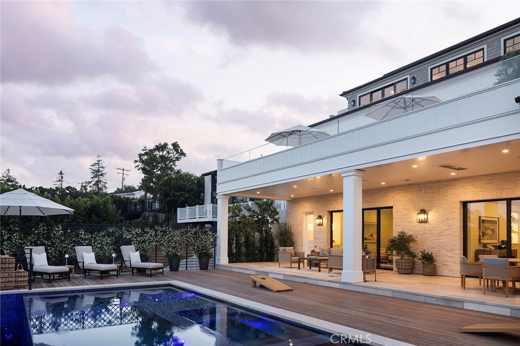 Designed by Acclaimed Architect Cynthia Childs | Built by Award-Winning Builder, Willhoit Construction | As Featured in Luxe Magazine |
Set upon one of the most serene streets in Newport Beach’s prized Cliff Haven enclave, this newly completed estate redefines coastal luxury with visionary design, enduring craftsmanship, and rare attention to detail.
Framed by sweeping ocean and harbor views, the residence unfolds across 5 bedrooms and 7 baths in a thoughtfully conceived open floor plan. The chef’s kitchen, a showcase of refined functionality, anchors expansive living and dining areas that flow seamlessly into a dramatic entertainer’s deck, idyllic, staged for golden sunsets and gentle sea breezes.
An artful wine room and bespoke bar with a flip-up serving window bring a touch of modern glamour, offering effortless indoor-outdoor entertaining. Beyond, a private backyard retreat that rivals the finest resorts, with a sparkling pool, spa, and generous spaces for al fresco dining and intimate gatherings.
Curated amenities include a Private elevator connecting all levels, a Dedicated home gym, a Versatile bonus room for leisure or work, and Light-filled interiors designed for both grand entertaining and day-to-day ease.
Located within one of Southern California’s most esteemed coastal neighborhoods, this residence balances privacy with proximity to acclaimed schools and the vibrant heart of Newport Beach.
This is more than a home; it is a legacy estate, an extraordinary expression of design and lifestyle, destined to be treasured for generations.