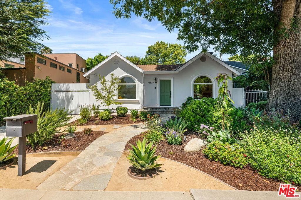 Chic 1920s charm meets modern living in this beautifully updated 3 bed + office, 2 bath gem in the heart of Studio City. Set behind lush native landscaping on a gorgeous tree lined street in Footbridge Square, this home features a thoughtfully remodeled kitchen and bathrooms, with warm hardwood floors and abundant natural light. The private backyard is a serene retreat with two mature avocado trees, fruit trees and lovingly tended raised garden beds. Located in a coveted Carpenter elementary school district and just moments from the new Sportsmen's Lodge and Ventura Blvd hot spots, this one checks every box for location, lifestyle, and classic California charm.