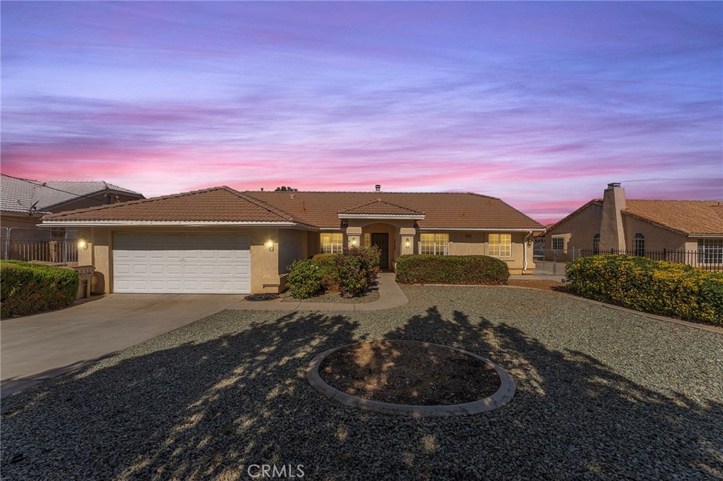 Beautiful Single-Level Custom Home with Dual Gated Driveways in a Desirable Hesperia Neighborhood! This stunning, lovingly maintained home features 3 bedrooms, 2 bathrooms, and a versatile office/bonus room that can easily serve as a fourth bedroom. Step through the front door and into an open-concept living space that seamlessly connects the living room, dining area, and kitchen — perfect for entertaining. The main living area showcases high ceilings, a cozy fireplace, and sliding doors that lead to the expansive covered patio and backyard. The spacious primary suite is thoughtfully positioned on its own wing for privacy and includes a massive walk-in closet and ensuite bath. The two additional bedrooms are generously sized and located on the opposite side of the home, ideal for guests or family. Additional highlights include:
• Brand-new flooring throughout
• Stainless steel appliances
• Central A/C and heat
• Large laundry room with storage
• Fully fenced yard with two gated driveways — plenty of space for RV and boat parking
• Three storage sheds and mature fruit trees
• Expansive covered patio, perfect for BBQs and outdoor gatherings. Septic certification is complete, and with only two previous owners, this beautiful home is ready for lucky owner number three! Located in a quiet, well-kept neighborhood close to shopping, schools, and the freeway — this property truly checks all the boxes for comfortable, California high-desert living.