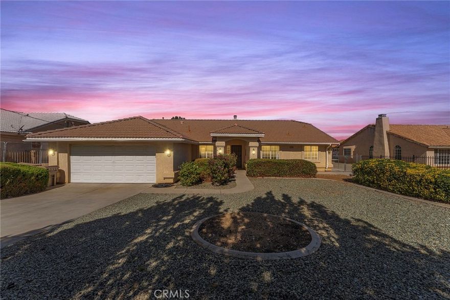 Beautiful Single-Level Custom Home with Dual Gated Driveways in a Desirable Hesperia Neighborhood!  This stunning, lovingly maintained home features 3 bedrooms, 2 bathrooms, and a versatile office/bonus room that can easily serve as a fourth bedroom. Step through the front door and into an open-concept living space that seamlessly connects the living room, dining area, and kitchen — perfect for entertaining. The main living area showcases high ceilings, a cozy fireplace, and sliding doors that lead to the expansive covered patio and backyard. The spacious primary suite is thoughtfully positioned on its own wing for privacy and includes a massive walk-in closet and ensuite bath. The two additional bedrooms are generously sized and located on the opposite side of the home, ideal for guests or family. Additional highlights include:

• Brand-new flooring throughout

• Stainless steel appliances

• Central A/C and heat

• Large laundry room with storage

• Fully fenced yard with two gated driveways — plenty of space for RV and boat parking

• Three storage sheds and mature fruit trees

• Expansive covered patio, perfect for BBQs and outdoor gatherings. Septic certification is complete, and with only two previous owners, this beautiful home is ready for lucky owner number three! Located in a quiet, well-kept neighborhood close to shopping, schools, and the freeway — this property truly checks all the boxes for comfortable, California high-desert living.