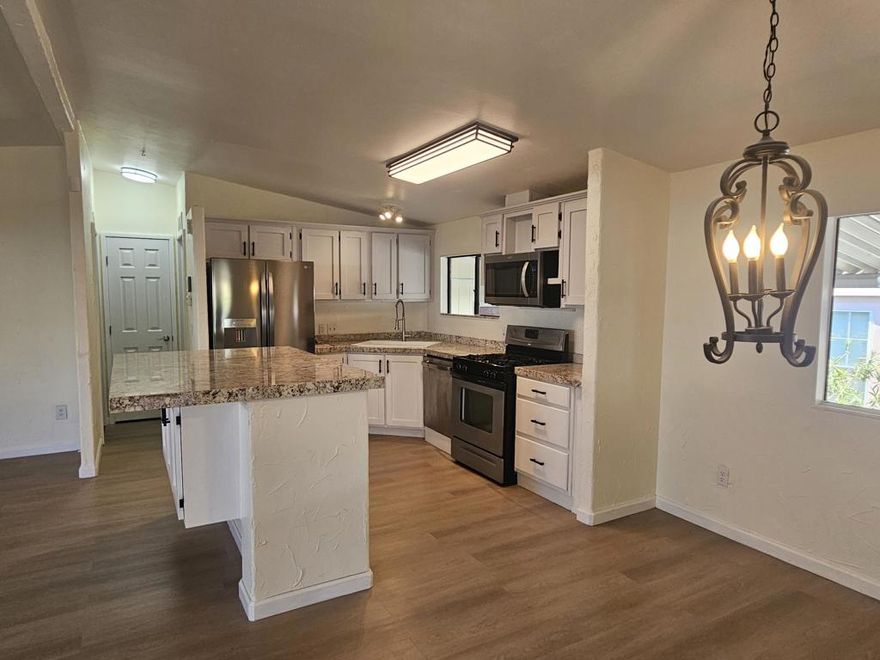 Step into comfort and confidence with this beautifully updated manufactured home on a 433a permanent foundation in the sought-after 55+ gated community of Vista Montana in Desert Hot Springs. This move-in-ready gem offers two spacious bedrooms and two full bathrooms, each with dual-sink vanities creating the perfect blend of style and function. Inside, you'll find new flooring throughout, a sleek kitchen with granite counters and stainless steel appliances, and brand-new cabinetry that adds a modern touch. Both bathrooms have been completely remodeled, and the interior and exterior have been freshly painted for a crisp, clean finish. Enjoy outdoor living on the new front porch or take advantage of the new stairway entrance from the covered carport. The roof is brand new and has been upgraded to the more expensive 3 tab. A private storage shed offers added convenience, and the low-maintenance landscaping makes it easy to lock and leave. Located in a secure, amenity-rich community with a clubhouse, pool, spa, sauna, card room, and even a picnic area with pet-friendly rules to boot, this home delivers lifestyle and value in equal measure.