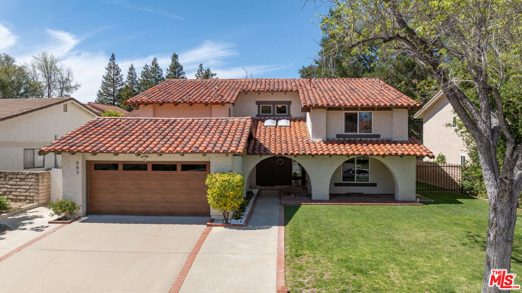 Welcome to this spacious and beautifully maintained 4-bedroom, 3-bathroom home nestled in the heart of desirable Westlake Village. Boasting 2,824 sq.ft. of living space on a generous 7,840 sq.ft. lot, this home combines style, functionality, and comfort for modern living. Step inside to find a versatile floor plan featuring one bedroom and one full bathroom on the main level perfect for guests, a home office, or multigenerational living. The extra-large primary suite upstairs offers a peaceful retreat with a walk-in closet and ensuite bathroom. Two additional well-sized bedrooms are thoughtfully positioned on the opposite side of the home, sharing a full bathroom, with it's own vanity sink in each bedroom. The kitchen is equipped with center island, ample cabinetry, and a large sliding glass door leading to the private backyard. Enjoy meals in the adjacent dining room, which also opens to the yard, creating seamless indoor-outdoor flow. The spacious living room features an oversized window that fills the space with natural light, while the cozy family room includes a fireplace and additional access to the lush backyard. Outdoors, you'll find mature fruit trees and an expansive grassy area, perfect for relaxing or entertaining. Additional features include the utility/laundry room and extra storage, which is strategically located between the kitchen and the2-car attached garage. Located in a peaceful, family-friendly neighborhood, enjoy strolls to the nearby community park with a baseball diamond, playground, and large open green space. The HOA includes access to a clubhouse, pool and spa, and tennis courts (just $260/quarter). Minutes from top-rated schools, shopping, dining, golf courses, and more this home truly offers the best of Westlake Village living.