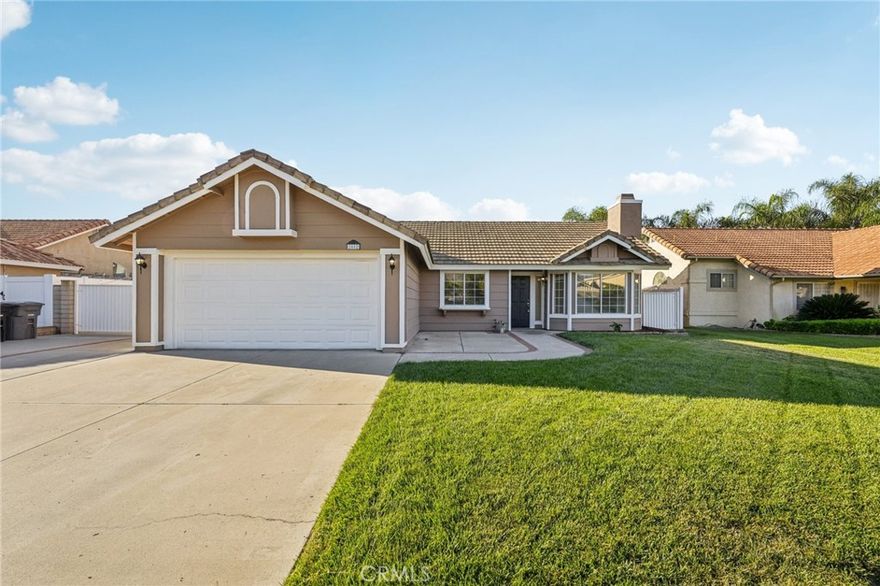 Charming single-story home featuring 3 bedrooms and 2 bathrooms with a 2-car garage and RV gate. Enjoy a bright, open floor plan with skylights and a bay window in the living room, complete with a cozy fireplace. The kitchen offers a convenient bar for casual dining, while the primary suite boasts a double vanity. Step outside to a fenced backyard and relaxing back porch, perfect for entertaining. One or more photos have been virtually staged. Schedule a showing today!