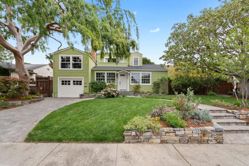 Nestled in the heart of Belmont, this home unveils a dream location and boasts a corner lot location with superb curb appeal. The main level hosts the living and dining area, adorned with exquisite hardwood floors, recessed lighting, and crown molding and elegant gas fireplace. French doors from the dining area lead out to a sleek IPE (Brazilian walnut) back deck area. The remodeled kitchen features Caesarstone countertops, stainless steel appliances and a garden window that overlooks the backyard deck. Two bedrooms and a remodeled bathroom grace complete the main level space. Above the attached garage, a versatile family room offers the option for a 4th bedroom suite. Vaulted ceilings, exposed beams, and a stunning half bath. The luxurious primary suite, on a separate level, exudes tranquility, boasting a quaint sitting area alcove, expansive closet, and a sunny balcony. The primary bathroom offers a spa-like experience with a large stall shower, separate oversized soaking tub, double sink vanity, and skylight. Outside, the enchanting backyard beckons with additional spaces for relaxation with hot tub, covered pergola, and stone paver patio. Additional amenities include central air conditioning, an attached 1-car garage with washer & dryer hook ups and an outlet for EV charger.