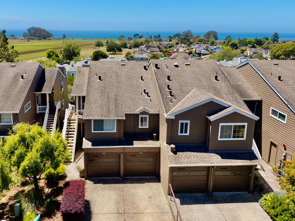 Welcome to this spectacular condo in a coveted development near the ocean with, you guessed it, OCEAN VIEWS right from your living room, family room, bedroom and deck! This home features so much natural light due to not only the expansive floor-plan, but also the numerous double-pane windows throughout including extra side windows due to the fact that this is an end unit with only one neighbor! All living areas have been planned out beautifully with spacious bedrooms and all living areas. The beautiful wood flooring throughout that is very popular today give this home so much class and functionality that also includes durability! Both bedrooms are spacious with plenty of closet space and the primary suite is jaw dropping with its space, seating areas and private bathroom with lots of closet space too. Currently, the primary suite is being used as an entertainment room. Downstairs is a separate family room with a fireplace and access to spacious rear deck and also another bedroom with access to deck. The floor-plan of this home is one of the best you will ever see and experience, so many options and so much thought has went into the design of this home. Want to go to the beach or play some golf? Heck, you could do both in the same day as it is just down the road!