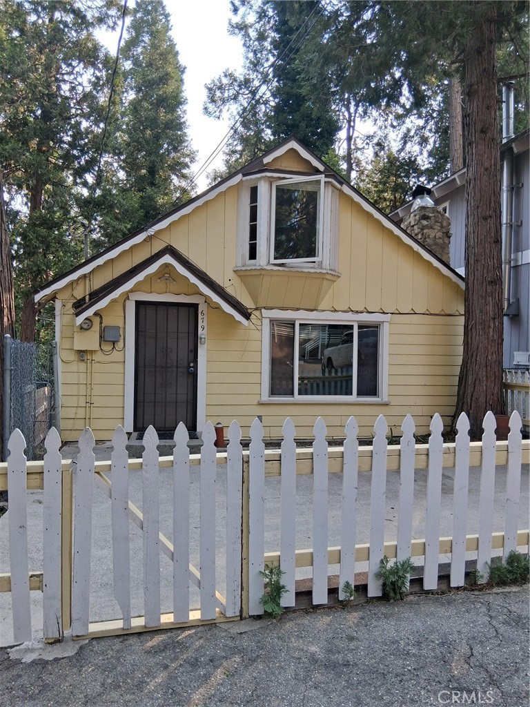 Great commuter friendly location on Hwy 138. Parking in front for 2 vehicles with level entry into house. Nice concrete patio in front with fence. Main level has 2 bedrooms and 1 full bathroom. There is a fireplace in the living room that will keep the house plenty warm in the winter. Kitchen has laundry inside along with refrigerator. Easy access to very large deck in back through kitchen. Second floor has loft area and bedroom. There is also a half bath on second floor. The yard is partially fenced.