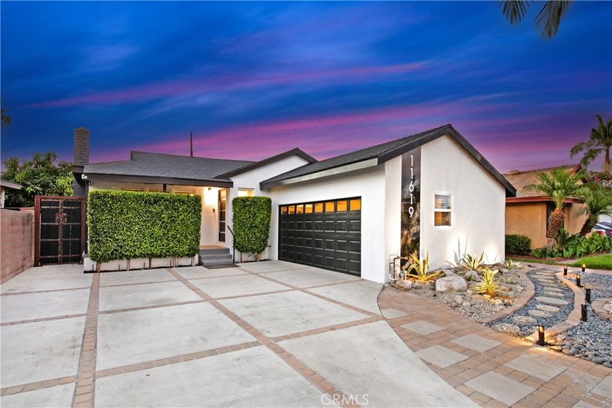 Indoor-outdoor living at its best! This one-of-a-kind 3 bedroom, 2 bath home in the heart of Downey is remodeled like none other! The centerpiece is a gourmet kitchen with high-end stainless steel appliances, book-matched thick granite counters, and custom KraftMaid cabinets. Both bathrooms have been updated, especially the primary bathroom with its oversized tile shower with a premium shower set, dual sinks/vanities and lighted mirror. The home has refinished hardwood original floors through out and refinished original interior doors. From the cozy living room with granite fireplace and built in bookshelves, you’ll step through the foldable glass doors into your entertainer’s backyard that boasts an all-time outdoor kitchen with BBQ, cooktop, warmer and mini-refrigerators and a covered patio with solid wood and anchors and a gas firepit to enjoy in the evenings, surrounded by decorative lights. Other amenities include a automated, coded steel front door, new oversized tankless water heater and gas meter, all new plumbing, central air and heat, new electrical panel and wiring, new fascia boards and exterior paint, Ring doorbell and perimeter cameras, and an insulated steel garage door with automatic opener. Look no further -- your dream home awaits you.