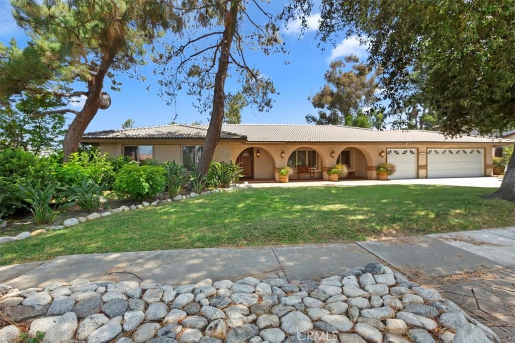 Gorgeous single story pool home, located on a beautiful tree lined street in North Claremont. Lovely front porch, double door entrance, vaulted ceiling in living room and in family room vaulted open beam ceiling, family room is open to the nook area and kitchen with a large center Island. Gorgeous views of the very private backyard with covered patio, pool and spa and the lovely rose gardens. This home has so much to offer, newer central heating and air conditioning, dual pane windows, newly painted through out, recess lighting in the secondary bedrooms and completely updated bathroom. Double door entrance to the primary bedroom, which has a large slider with direct access to the backyard. The primary bath has also been completely updated.
Laminate flooring in secondary bedrooms and hallways. Large indoor laundry room also with access to the backyard. You will love this home conveniently located near schools, parks, shopping and easy access to freeways.