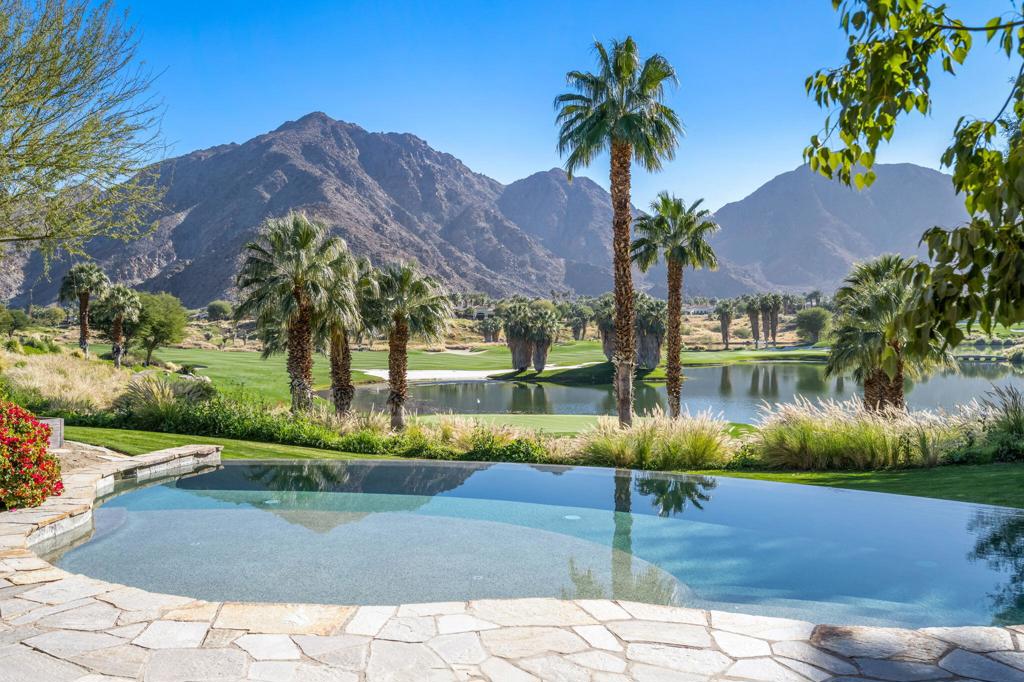 Best views at Tradition Golf Club! Two swimming pools! South facing sun, nestled on a bluff above the 7th green. This exquisite Tuscany masterpiece displays the absolute finest craftsmanship w/ color infused walls, extensive stonework, wood sliding pocket doors & windows & massive hand-hewn timber ceilings. Designed by award winning architect Gordon Stein with 4 bedrooms and office, and built with the finest materials including travertine floors, gorgeous countertops and stone walls. Stunning front doors, Gourmet cook's kitchen with gas Range, top of the line appliances and Wine Room. An entertainers dream with pocketing doors opening to south rear patio and huge courtyard to north. Perfect flow with this open floor plan and huge outdoor covered loggia with nearby BBQ and infinity edge pool. Beautiful master bedroom with amazing views. Privacy, Serenity and the ultimate entertaining house. The best of the best! Offered furnished per inventory