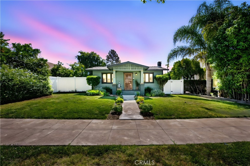 Welcome to 560 N Campus Avenue, a truly exceptional residence nestled in the heart of Upland’s coveted Pleasant View Historic District and enrolled in the coveted MILLS ACT PROGRAM. This 1924 California Craftsman home is a stunning blend of preserved architectural charm and carefully integrated modern upgrades. From the moment you arrive, the curb appeal captivates with lush landscaping, and inviting front and rear porches that echo the warmth and character of the home.
Step inside to discover restored original red oak hardwood flooring, beautifully refinished vintage hardware, and a new fireplace hearth that anchors the cozy living space. The updated kitchen is both stylish and functional, featuring granite countertops, stainless steel appliances, a wine fridge, and tile flooring. Ceiling fans grace the bedrooms and dining area, while new carpet in both bedrooms adds comfort underfoot. The bathroom has been tastefully renovated with a new vanity and updated tile, blending timeless style with modern sensibility.
The home has been thoroughly updated for peace of mind and efficiency, including fresh exterior paint, a roof inspection with recent repairs, all-new window screens, Hunter Hydrawise smart irrigation system, a tankless water heater, and a full earthquake retrofit with foundation bolting. The main sewer line has also been replaced, ensuring the property is as sound structurally as it is visually appealing.
Step outside into a backyard oasis ideal for entertaining or quiet retreat. surrounded by mature fruit trees, garden and meticulous landscaping. A top-of-the-line vinyl privacy fence wraps around the entire backyard, including a custom vinyl RV gate for alley access. The property also has an impressive 14x72 RV parking pad, in addition to a vintage galvanized and wood garage set on a solid concrete slab 10x20 — perfect for a workshop, off road toys or motorcycles.
All of this plus walking distance to the heart of Downtown Upland, where you can enjoy live music and craft beer at King’s Brewing & Smokehouse, a juicy burger or sandwich at JD Allison’s, mouthwatering slices at Paulie’s Pizza, or an upscale meal at Studio 429. The area is home to year-round community events including the Upland Lemon Festival and Upland Irish Festival — fun for the entire family. With quick access to both the 10 and 210 freeways and a short walk to the Metrolink, commuting and exploring Southern California has never been easier.