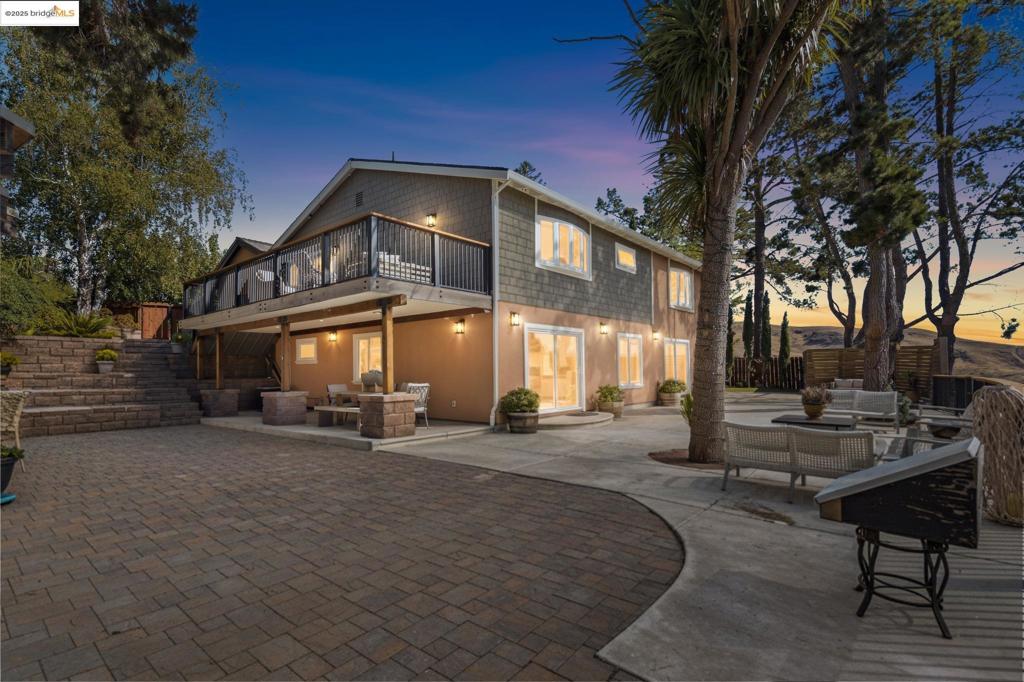 Designer masterpiece—down-to-studs reinvention in Moraga’s coveted Campolindo. Minutes to top-rated schools, shops, trails, Hwy 24 & BART. Flexible two-level layout that can live together or independently: each level has its own entrance and primary suite; the upper level showcases a magazine-worthy chef’s kitchen, the lower level adds a kitchenette and a generous family/game room. Quality shines throughout: all-new systems, radiant heated floors on the lower level, Simonton energy-efficient windows/doors, recessed lighting, European-style interior doors, luxury accent wallcoverings, and gorgeous water-resistant flooring. The statement kitchen pairs Italian Cucine Lube cabinetry, quartz, BLUM hardware, Fisher & Paykel fridges, Samsung double oven/cooktop & twin dishwashers, wine fridge, sun tunnels, and a 10’ Milgard slider to a view deck. Outdoor living is resort-caliber: multiple view decks, new hardscape & paver patios, perimeter drainage, and three rain-water collection tanks for eco-irrigation. Enjoy a roof-covered outdoor kitchen and a detached cedar sauna retreat with bathroom and lounge. Set on a huge lot with mature landscaping and an orchard’s worth of fruit trees. A rare turnkey compound with multi-gen and ADU-style flexibility—crafted for effortlessly luxurious living