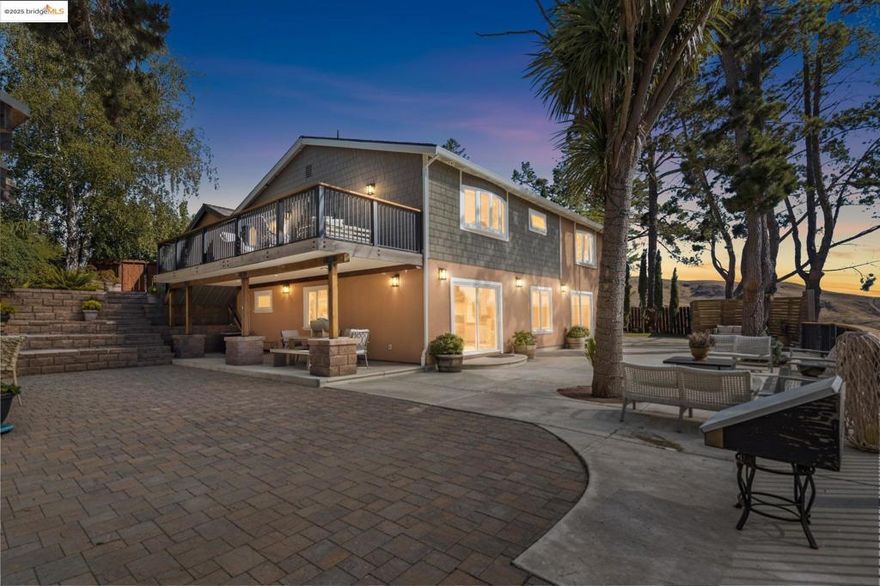 Designer masterpiece—down-to-studs reinvention in Moraga’s coveted Campolindo. Minutes to top-rated schools, shops, trails, Hwy 24 & BART. Flexible two-level layout that can live together or independently: each level has its own entrance and primary suite; the upper level showcases a magazine-worthy chef’s kitchen, the lower level adds a kitchenette and a generous family/game room. Quality shines throughout: all-new systems, radiant heated floors on the lower level, Simonton energy-efficient windows/doors, recessed lighting, European-style interior doors, luxury accent wallcoverings, and gorgeous water-resistant flooring. The statement kitchen pairs Italian Cucine Lube cabinetry, quartz, BLUM hardware, Fisher & Paykel fridges, Samsung double oven/cooktop & twin dishwashers, wine fridge, sun tunnels, and a 10’ Milgard slider to a view deck. Outdoor living is resort-caliber: multiple view decks, new hardscape & paver patios, perimeter drainage, and three rain-water collection tanks for eco-irrigation. Enjoy a roof-covered outdoor kitchen and a detached cedar sauna retreat with bathroom and lounge. Set on a huge lot with mature landscaping and an orchard’s worth of fruit trees. A rare turnkey compound with multi-gen and ADU-style flexibility—crafted for effortlessly luxurious living
