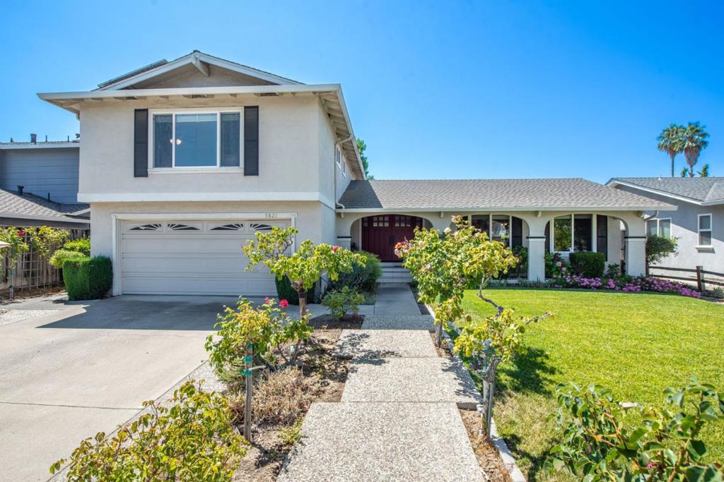 Welcome to this spacious 4-bedroom, 2-bathroom home in San Jose in a quiet cul-de-sac, with 2,108 sq ft of living space situated on an 8,050 sq ft lot, this home provides ample room for family living. The upgraded kitchen features a gas cooktop, newer appliances, granite countertops on refaced cabinets. The garden window adds charm and light to the space. Enjoy family meals in the kitchen or formal dining room. Enlarged upstairs main bathroom with custom cabinetry, pony wall, and travertine floors. Large living room perfect for entertaining family and friends plus a separate family room with fireplace. The home boasts a variety of flooring options, including carpet, hardwood, and tile, providing a mix of style and durability. Additional amenities include high ceilings and energy-efficient features like solar power, whole house fan, and double pane windows. Other general improvements include, replaced interior doors whole-house fan, Reflectix insulation, copper plumbing, new gas line, new furnace, A/C, and ductwork. Beautifully maintained front yard with roses. Serene backyard with two storage sheds, hot tub, Trex decking, built-in benches Peaceful hillside views of Guadalupe Oak Grove Park. Conveniently close to Jeffrey Fontana park and Oak Grove park,