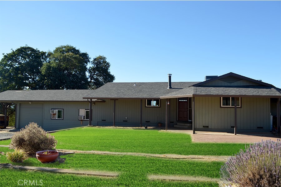 Kelseyville home on private 10.5+/- acres right outside of town! 2 bedroom, 2 bath home with two bonus rooms and a large barn! Public/city water, a beautiful lakeview. Roof, gutters were installed in 2020. Fenced backyard with covered patio ready to create your majestic garden! 12ft tall carport for RV/trailer/boat parking. Completely secluded feel but with a surprising 3 minute drive into downtown Kelseyville/schools.
