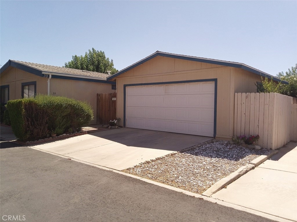 This charming home offers 3 bedrooms, 2 full baths, and an additional versatile room that the seller has converted into a fourth bedroom. The buyer can either keep it as is or easily transform it back into a cozy den. The master bedroom is a spacious retreat, featuring generous shelving, extra storage, and a large walk-in closet. Throughout the home, you’ll find sleek laminate flooring—completely carpet-free for easy maintenance. Step outside to enjoy a spacious private yard, perfect for relaxation or entertaining, along with a convenient two-car garage that boasts a brand-new garage door engine. Inside, both bathrooms are in pristine, white-clean condition, with all utilities working flawlessly. Stay comfortable year-round with central A/C, regulated by a smart thermostat that can be turned off when not needed. The home’s location is a major plus—situated in a peaceful and secure area, with neighbors at a comfortable distance while still being within walking distance to the community swimming pool, spa, dog park, library, rec room, BBQ areas & RV parking. It’s also near the entrance gate for easy access but tucked away in a safe and quiet nook. For 55+ older, the neighborhood is incredibly secure, with two schools nearby. You’re also just a short drive from shopping centers, restaurants, movie theaters, and plazas, with a community college only four miles away. The I-15 freeway is just nine miles away, making commuting a breeze. The motivated seller is even including a washer and dryer in the laundry room, which also features additional closet space. As a bonus, buyers have the option to keep the beautiful custom-made curtains throughout the home, a unique mix of blinds, chiffon, and elegant drapery. An added perk—water, sewer, and trash are covered through the park for just $850. Don’t miss the opportunity to make this wonderful home yours!