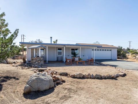 Photo of 5564 Old Woman Springs Road, Yucca Valley, CA 92284 (MLS # JT26053886)