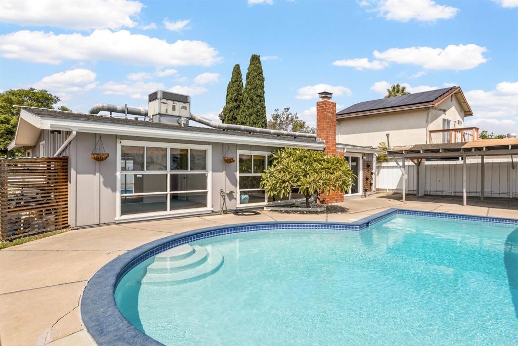 Welcome to your own little slice of sunny San Diego living in the heart of beautiful Serra Mesa! This turnkey home is move-in ready, so you can skip the “weekend renovation” phase and head straight to your sparkling blue pool. Inside, every finish has been tastefully updated with a modern, cohesive style. Floor-to-ceiling windows flood the open floorplan with natural light, and a cozy fireplace adds just the right amount of charm for cool evenings. Freshly updated bathrooms shine and the kitchen with its gorgeous countertops is ready to make everything, from your morning coffee to holiday dinners, feel just a little more special. Out front, a beautiful, gated courtyard sets the stage for a warm welcome, while the backyard is your own private retreat complete with a sparkling pool, a shady lounge area perfect for lazy afternoons, plenty of space to entertain and unwind and even a storage shed to keep things tidy. The location? Spot-on! Less than a mile from Snapdragon Stadium, you’ll have concerts, games, and events practically in your backyard! And let’s not forget all the shopping, dining, and entertainment Mission Valley has to offer just minutes away. It’s San Diego living at its absolute finest.