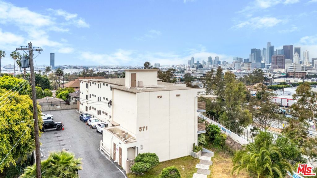 This 38-unit apartment building offers significant upside through interior and exterior renovations. With rents below market and many units in original condition, a strategic value add approach can unlock immediate equity and long-term rental growth in one of LA's most culturally rich and rapidly evolving neighborhoods. Located within a designated Opportunity Zone, this asset presents substantial tax incentive potential for investors. Qualified buyers can defer or reduce capital gains taxes by reinvesting in this property, enhancing both short-term profitability and long-term financial planning. The building offers the unique ability to be repositioned as an affordable housing asset. This strategy may qualify the buyer for property tax abatements, reducing operating expenses while meeting a critical housing need in Los Angeles. Buyer to verify program eligibility and guidelines. Positioned just one mile from Downtown LA, this is the closest you can be in Boyle Heights to the city's urban core. The property benefits from the convenience, employment, and amenities of Downtown while maintaining the charm and character of a residential enclave. Twelve of the units enjoy breathtaking, unobstructed views of the Downtown Los Angeles skyline. These desirable outlooks are a premium feature that adds instant appeal for renters seeking an elevated living experience, setting the property apart from competing assets. Centrally located between the USC Medical Center and White Memorial Hospital, this building is ideally situated to attract healthcare professionals, students, and staff. The surrounding medical infrastructure continues to grow, providing stable rental demand and strong tenant demographics. The property includes valuable onsite parking, a significant advantage in a high-density urban environment. This convenience enhances tenant satisfaction and broadens your potential renter pool, especially among professionals and commuters.