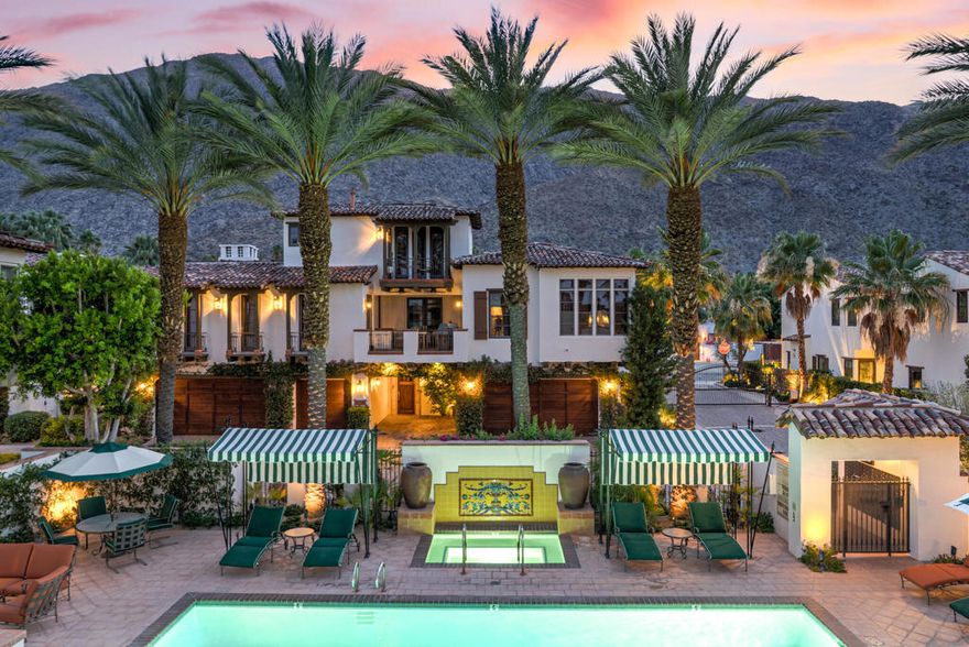 You're sure to be charmed by this recently built Historic Tennis Club home in St. Baristo Villas, where from numerous balconies you see both the City of Palm Springs and Mountains. Owing to its proximity to the exquisite resort-like Baristo Villas pool complex, these views are largely unobstructed.  As you enter the front patio framed by Italian cypresses, you arrive into a formal entry where you can use your private elevator or take the elegant staircase leading to the main living area. If entertaining is to your liking, here you find a gourmet kitchen with sizable terrace, a breakfast area, and grand living room with adjoining dining area, all connected and on one floor. The kitchen boasts premium Viking appliances, handsome cabinetry, and a convenient island with bar seating-perfect for casual meals or entertaining guests. On the penthouse level, you enjoy a private balcony and a luxurious ensuite with double sized shower and bench. On the main level, guests will appreciate their own private retreat  with oversized shower & standalone tub with window overlooking the pool.The superb location places you just steps from downtown Palm Springs' vibrant attractions, including the Palm Springs Art Museum and Forever Marilyn statue.  After exploring the city, return home to relax by the beautiful resort-like pool, visible from your residence.  This property offers the option to purchase the playful, colorful furnishings outside of escrow, allowing you to move in and immediately embrace the Palm Springs lifestyle.