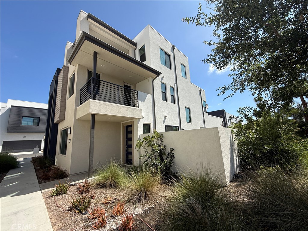 Newer Built 2022 by Taylor Morrison! Only one wall attached, End unit with nice Side Yard and Privacy view location. The stunning Plan 2X at Revo in Novel Park welcomes you from the moment you enter through the 2-car attached garage. A convenient bedroom on the first floor is perfect for visiting family or overnight guests and is just across the hall from a full bath with large shower. Continue into the spacious open kitchen and you will find everything you need at your fingertips including a cozy island that overlooks the dining and great rooms. Refrigerator, Washer/Dryer include. The second story is designed for living with a large primary suite complete with an oversized shower, walk-in closet, and dual vanities. Two additional bedrooms, a full bath, and laundry room with storage complete the second floor. The third floor rounds out this incredible home with a bonus room, rooftop deck and a powder room! Located within Irvine’s Great Park Neighborhoods, residents enjoy a wide range of lifestyle enhancing amenities: swimming pools, parks, dog parks, clubhouses, coffee shop, walking trails, tot lots, sports courts, and so much more! School-aged residents attend excellent Irvine USD schools – Beacon Park K-8 school is within short distance and Portola High School is less than five minutes away by car. Close to shopping and dining at Woodbury Town Center, and less than five miles from the Irvine Spectrum Center.