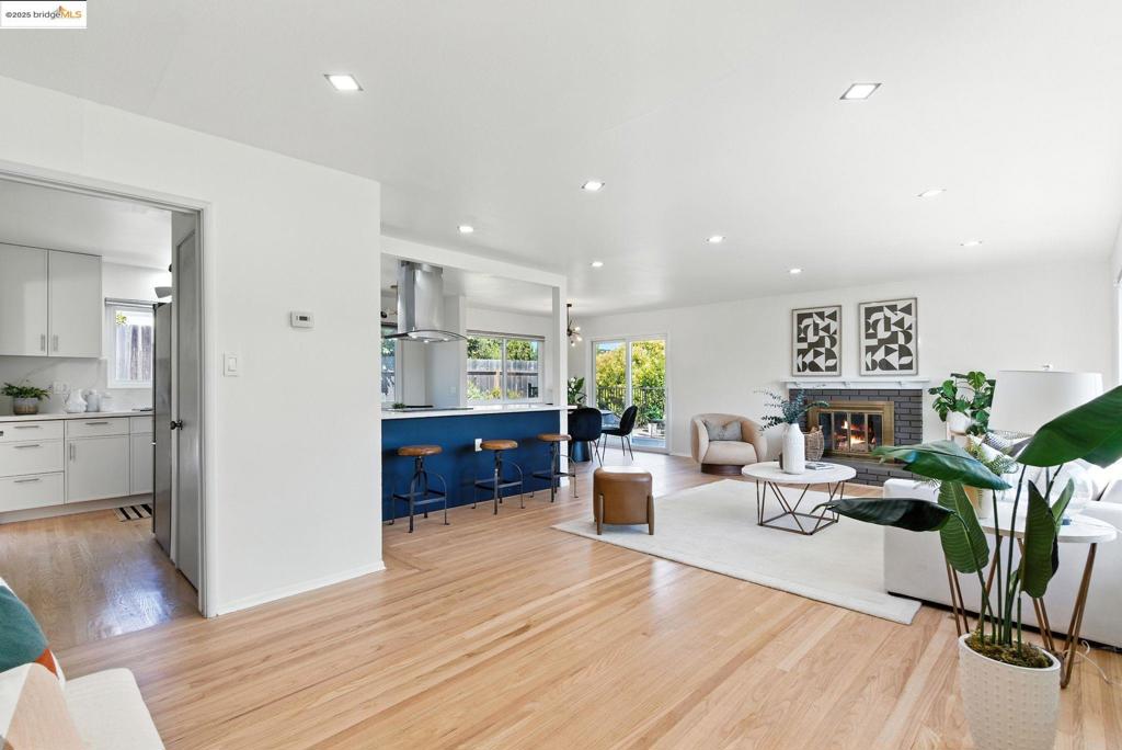 Beautifully updated mid-century on a premium lot w/ orchard, ADU, 2-car garage, RV parking, & views of the valley. Fruit trees, raised beds, & endless upgrades! This sunny May Valley home sits on a private corner lot and welcomes you into the living room where a broad picture window frames the El Sobrante hills & a fireplace provides warmth on cool nights. The bright, cheery remodeled (2025) quartz-top kitchen features stainless appliances & a sculptural hood. Oak floors—new in the kitchen & refinished throughout—unify the space. Sliding doors open to an elevated deck w/ valley views, while side deck planter boxes offer tomatoes, strawberries, & red beets. A fully permitted studio ADU w/ separate entry & sleek full kitchen is perfect for guests, multigenerational living, or rental income.* Two refreshed baths serve the main level, including one w/ a designer scalloped-tile shower. Out back, enjoy a dining patio, fire-pit deck, raised beds, & a small orchard w/ apples, peaches, pears, figs, citrus, & olive trees. Recent upgrades include dual-pane windows & exterior paint, gas heat & A/C, French drainage, & a camera security system. With a two-car garage, RV parking, & generous off-street space, this turnkey property is close to schools & parks. Uplifting from the moment you enter