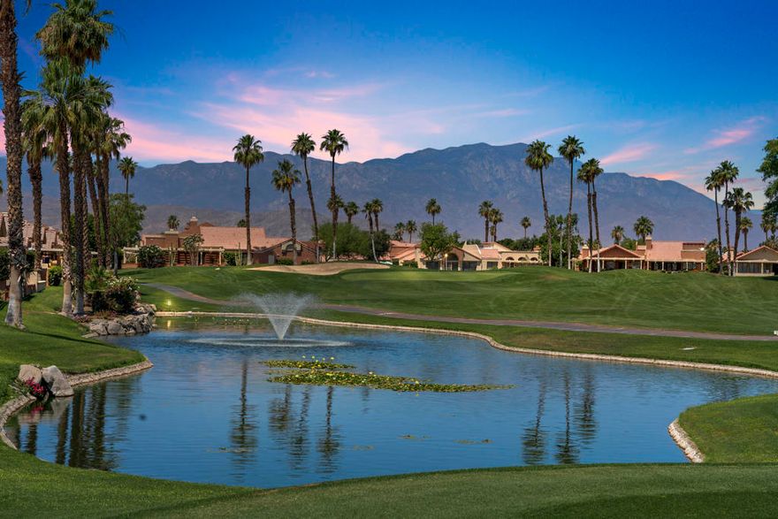 SUMMER SPECIAL PRICING!Welcome to one of the most coveted floor plans in Oasis Country Club--a spacious, detached 3-bedroom, 2-bath home that stands as the largest model available, offering the perfect blend of comfort, elegance, and breathtaking views.&#10024; Special Financing Opportunity: This home comes with a transferable (with approval) 2.3% VA loan, making it an incredible value for qualified buyers seeking both luxury and savings.From the moment you arrive, lush landscaping and a serene fountain create a welcoming ambiance. Step inside to a beautifully upgraded, light-filled interior featuring custom touches throughout. The newly remodeled kitchen is a standout, showcasing quartz countertops, a designer backsplash, wine refrigerator, and a gas cooktop--ideal for the culinary enthusiast.Both bathrooms have been tastefully renovated, with the primary suite offering a spa-like retreat complete with a soaking tub, separate shower, and custom built-ins in the walk-in closet. The third bedroom doubles as a versatile office or guest space, featuring a built-in desk and Murphy bed.Notable upgrades include a custom stained-glass front door, a built-in bar and mantle in the living room, and a dedicated interior laundry area. The finished garage is equipped with storage cabinets, a new garage door opener, split A/C unit, and a dedicated space for your golf cart.Step outside to a private patio with sweeping views of the lake, fairway, and surrounding mountains. Complete with a built-in BBQ and covered for year-round comfort, it's the perfect spot to unwind or entertain. A turf-lined dog run adds thoughtful convenience for pet lovers.Oasis Country Club offers a vibrant, resort-style lifestyle with access to golf, pickleball, tennis, a welcoming clubhouse, and a full calendar of social events. This home is more than a desert retreat--it's a lifestyle upgrade with an unbeatable financing advantage.