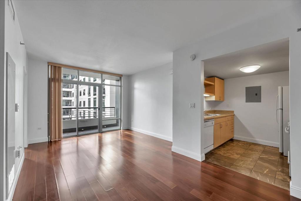 Welcome to your new home in the heart of Little Italy! This stunning 1 bedroom, 1 bathroom home is in the North Tower, and showcases beautiful hardwood floors in the living and dining area, floor-to-ceiling windows, and luxurious marble flooring in the kitchen and baths! Step out onto your spacious balcony off the living room to take in the fresh air and enjoy the view. Indulge in Acqua Vista's fantastic amenities, including a swimming pool and hot tub, and a BBQ area for hosting fun get-togethers with friends and family. As a resident, enjoy access to an exercise room, and EV charging stations for your electric vehicle. There are also Amazon lockers in the garage to make package deliveries easier. This building also features 24-hour attendant/security and valet parking for your peace of mind. Acqua Vista is conveniently located just steps away from the best dining options, farmers market, shops, Downtown, and Seaport Village!