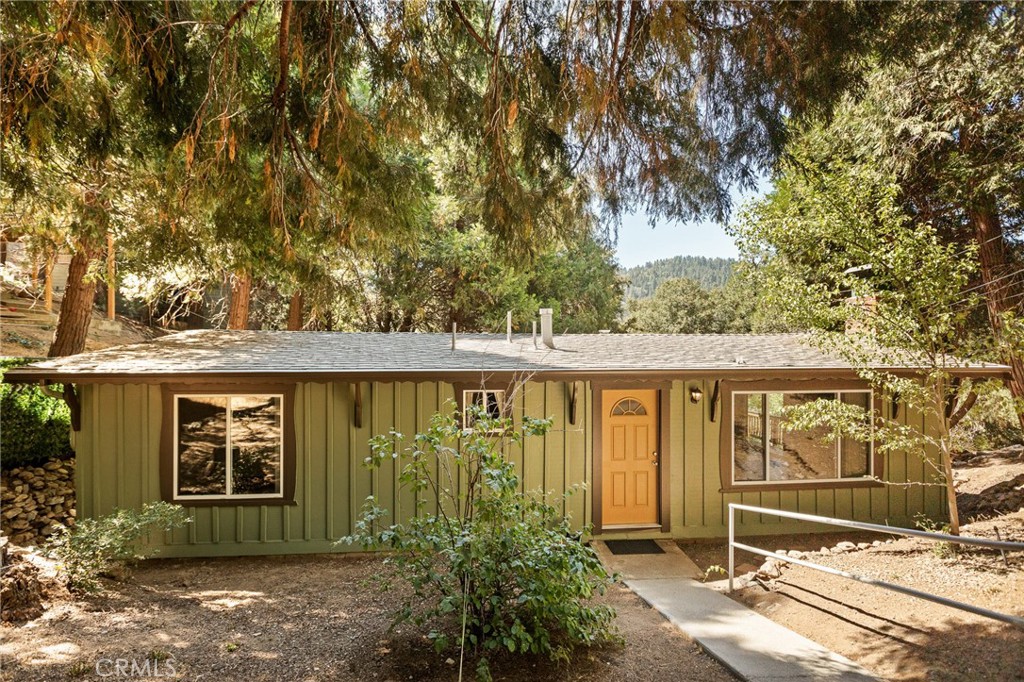Welcome to 24243 Zell Court — a beautifully maintained home tucked away on a quiet cul-de-sac in the heart of Crestline. This inviting property offers the convenience of all one-level living, making it ideal for anyone seeking comfort and accessibility.
Situated just a stone’s throw from glistening Lake Gregory, you’ll enjoy mountain living at its best with lake recreation, hiking trails, and village amenities all nearby. The home features an easy, gradual path to the front entrance and ample level parking for three or more vehicles with a concrete parking pad— a rare find in this area!
Once inside you'll find fresh interior paint and dual-pane windows that bring in natural light while keeping the home cozy year-round. The home features an open concept living room and kitchen with vaulted ceiling and wood burning fireplace. Down the hallway are 3 well appointed bedrooms, one of which is the primary with an ensuite bathroom, and another full bathroom. Moving outside, the exterior has recently been restored and fully repainted with a spacious deck to enjoy the beautiful surroundings and includes an exterior closet with laundry hookups. The home comes with an additional, vacant lot and the property is dotted with fruit & almond trees. There is a large build-up area that provides an excellent storage option.
Don’t miss this move-in-ready gem with modern updates such as air conditioning, seamless gutters, quality LVP flooring in the common areas along with under-tile bathroom floor heating. You'll love the serene surroundings, easy access and unbeatable location. Whether you're looking for a full-time residence, vacation getaway, or investment, 24243 Zell Ct offers it all.