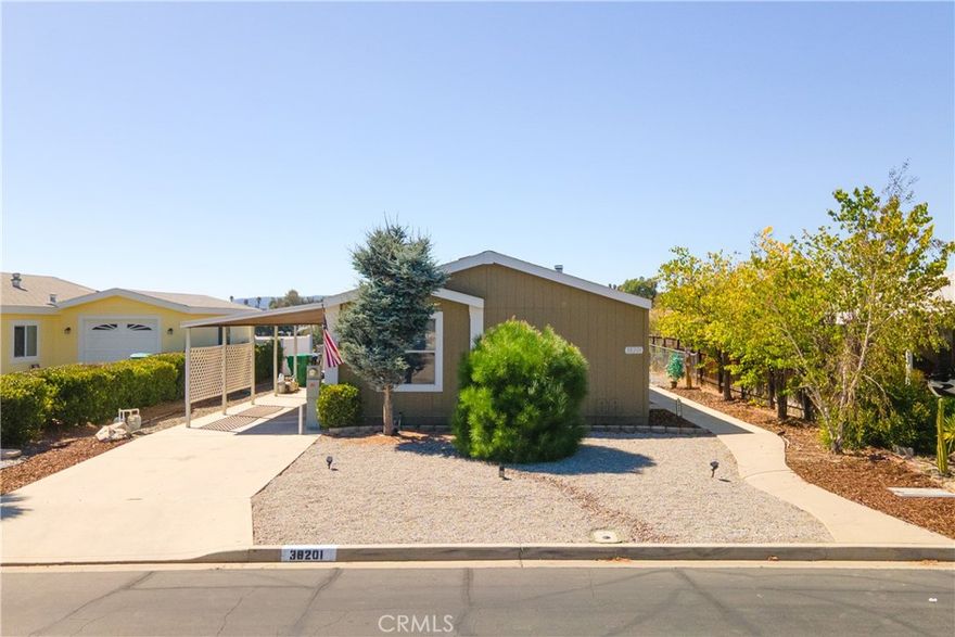 ***Charming Turn-Key Home located in the Heart of Murrieta's Premier 55+ Community - Warm Springs Knolls. YOU OWN THE LAND! Low HOA Dues! Low Taxes. This 2008 Manufactured Home on a permanent foundation is located in the Warm Springs Knolls Community. Walking distance to The Club House that offers resort style amenities, is designed to enrich the lifestyles of active seniors. The Club House includes - Kitchen, Meeting Room, Ballard Table Swimming Pool, Enclosed Spa, Showers in Restroom, Exercise Classes, lots of Social Events and Activities.  This single story, 3 Bedrooms, 2 Bath home is ready to move in. As you enter the Front door into the spacious Livingroom a beautiful fireplace that warms the entire home. Kitchen has New Stainless Steel Appliances-as of 2022 - Refrigerator, Stove and Dishwasher, Beautiful Wood Cabinets spacious countertops. This Kitchen is a Chief Gourmets' dream come true! Spacious Eating Area with lots of Natural Light!  Primary Bedroom is it own retreat, very spacious and opens into its own private bathroom. Two other bedrooms -would be perfect for an Guest room, Office or Hobby room. The Separate Laundry Room includes Washer & Dryer purchased in 2022. The Flooring is neutral color Wood Laminate throughout the entire home for easy care.

Chain-link fenced surrounds the Backyard - Easy Care - Hardscape 3 different rock colors invites your imagination for the outdoor living ideas and peaceful enjoyment to watch the beautiful Stars and Sunsets over the City and Hills of the City of Murrieta. Plus you're minutes from shopping, dining and easy freeway acess for added convience. CALL - Make an Appointment  to Come See Your Forever Home today!