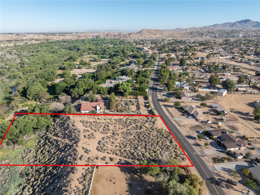 Are you looking for an Estate Lot? Here's a rare opportunity to purchase 3.12 acres on exclusive Riverside Drive. The lot sits fairly high with a view of the city and the Mojave River with beautiful homes all around. Build your dream home and use the lower portion for endless possibilities. Located on the Mojave River the land is perfect for Horses, cattle or what ever your fancy! Very few lots left, don't wait to long at this price it should sell quickly!