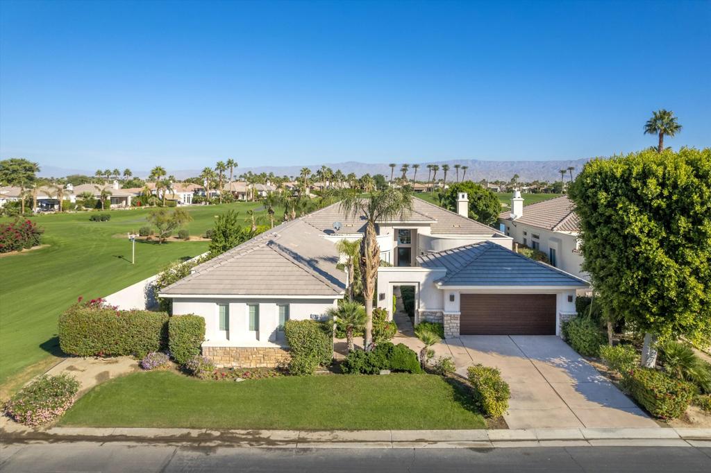 Owners using home last two weeks of April 2026. This 4BR/4.5BA (Including Casita) turnkey furnished home is situated on the 15th Fairway of Mountain View CC in La Quinta. With spectacular lake front mountain views, this beautiful property offers tenant all of the social amenities of the club, including access to pickle ball, tennis, bocce ball, fitness center and classes, heated community pool/spa, spa services and active social calendar of events, with tenant only paying a one time $750 social membership transfer fee. Well stocked kitchen with stainless appliances and dining area has adjacent formal dining room, living room with fireplace and wet bar and office, all with view of backyard pool and VIEW! Master bedroom suite has king bed, and bath with separate tub and shower, dual vanities, and big walk in closet. Two secondary bedrooms have ensuite baths, as does the casita. All bedrooms have smart TVs. Backyard patio has big sparkling infinity pool/spa, fire pit, dining table and patio furniture. Laundry room and attached 3 car garage rounds out the floor plan. Owner pays for HOA dues, and provides cable, internet, and all utilities, with $400 MO cap for combined gas/electric. $7000 security deposit. $500 cleaning fee. Dog allowed, with owner approval of dog and additional $500 pet deposit. $12,500 May. $15,000 MO Nov-April. Summer rates negotiable. No showings when tenant occupied. Photos are current.