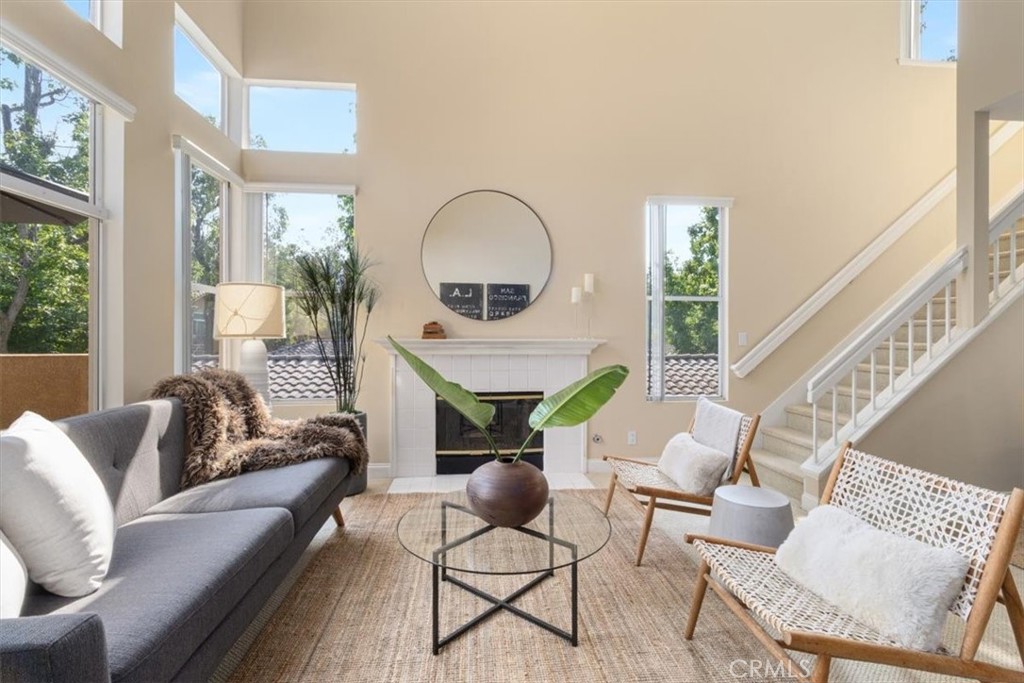 Welcome to your dream home! This stunning two-story, one-bedroom townhouse with a versatile loft is a masterpiece of modern design, bathed in natural light and exuding an open, airy ambiance. Perfect for those seeking a blend of style, comfort, and vibrant community living, this bright and spacious residence offers the ultimate in contemporary elegance. Step inside to discover a thoughtfully designed open floor plan, where soaring ceilings and expansive windows create a warm, inviting atmosphere. The main level features a sleek, well-appointed kitchen that flows seamlessly into the living and dining areas, ideal for entertaining or relaxing in style. The generously sized bedroom offers a serene retreat, complete with ample closet space and tranquil views. Upstairs, the versatile loft is perfect for a home office, creative studio, or cozy reading nook, adding flexibility to suit your lifestyle. Beyond the home, indulge in an array of resort-style amenities that elevate everyday living. Dive into relaxation with two sparkling pools and a soothing spa, or stay active with two tennis courts, a putting green, and a fully equipped gym. Host unforgettable gatherings at the clubhouse, available to reserve at no cost, or enjoy family fun at the playground. Practical perks like a car wash and electric vehicle charging station add convenience to your daily routine. Nestled in a vibrant community, this townhouse offers the perfect balance of tranquility and connectivity. Don’t miss the chance to call this light-filled, amenity-rich haven your home—schedule a tour today and experience luxury living at its finest!