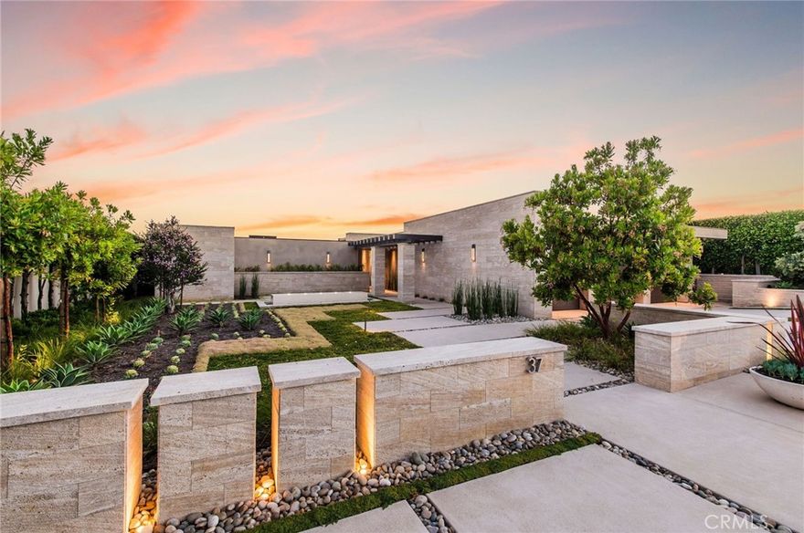 Showcasing unobstructed, panoramic views of the ocean & city lights from most of the living areas, this elegant soft contemporary home redefines coastal modern luxury.  



Set on a bluff overlooking the ocean in the prestigious, guard gated community of Monarch Bay, this single level home offers six en suite bedrooms, white oak floors and commanding views, framed by floor-to-ceiling windows and retractable glass doors. Extensively remodeled, this sophisticated custom estate has modern technology & a timeless architectural design that allows sunlight inside without sacrificing privacy. Oriented around a central courtyard with a step-entry pool and spa, the home includes a dramatic ocean view living room with a stone fireplace, a craft room and a bespoke gourmet kitchen with sleek, European-style cabinetry. A private entry with a water feature and a Zen-like design set the stage for this home, which has a family room with an 80” TV, high ceilings and an open floor plan. The minimalist interior ensures that nothing distracts from the alluring hues of the sea and sky; a variety of outdoor living areas make the home a relaxing venue for hosting large gatherings. The dining room has sit-down views and glass doors that open to an al fresco dining room with a retractable canopy, a built-in BBQ, a gas fire pit and built-in speakers. Illuminated by a large skylight, the kitchen boasts slab quartz counters, two built-in Subzero refrigerators, a six burner Gaggenau range and a pass-through service bar with riveting views. Large enough for caterers or the family chef, the kitchen also has a silent Bosch dishwasher, dual Wolf ovens, a Subzero wine fridge, and an adjacent walk-in pantry, complete with quartz counters, a sink and a washer/dryer. The open breakfast room has built-in seating, a beverage station and custom cabinets. Skylights in most of the bathrooms create a cheerful atmosphere; remote operated shades add to the sense of luxury. The primary suite has sweeping views, a walk-in shower and a freestanding tub. Other features include two laundry rooms, a security system, smart home technology, & a three car garage w/Tesla charger. Marvel at the splendor of daily sunsets, host a fun event on the spacious ocean view backyard, enjoy the peace of mind that comes from knowing all the major systems have been updated, easily access the Monarch Bay Beach Club, bocce ball, tennis & pickleball courts, or just unwind in the spa and watch the stars—the options are endless.