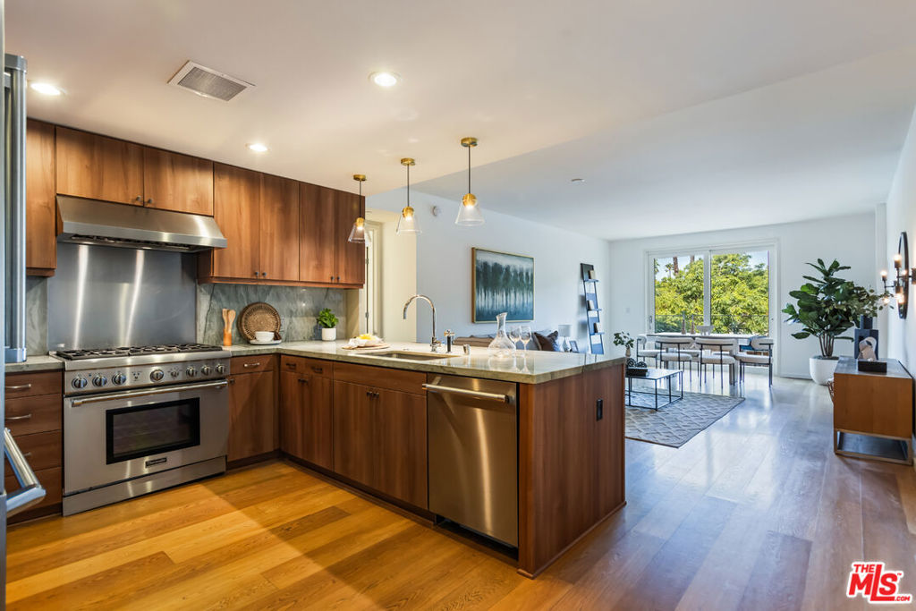 Experience luxury coastal living in one of Ocean Avenue's premier newer buildings, just moments from the beach, Tongva Park, and the best of Downtown Santa Monica. This beautifully upgraded 2-bedroom, 2-bathroom residence features a bright, open floor plan with premium finishes and seamless indoor-outdoor flow. The designer kitchen boasts new cabinet fronts, updated hardware, elegant pendant lighting over the island, and top-of-the-line Thermador appliances. The spacious primary suite offers a spa-inspired bathroom with Dornbracht fixtures, generous closet space, and direct access to a private terrace overlooking Tongva Park. The second bedroom also includes an en-suite bath and a fully built-out walk-in closet by California Closets, ideal for guests or a home office. Additional upgrades include custom wall sconces, updated bathroom cabinetry, brand-new exterior windows and sliding glass doors, Central AC by Carrier, and an in-unit Electrolux washer and dryer. This unit also includes two of the most conveniently located side-by-side parking spaces in the building, right next to the elevator lobby well as a large, private storage room. Building amenities include a 24-hour doorman, state-of-the-art fitness center, and a resident sky lounge with a full kitchen and sweeping ocean views.