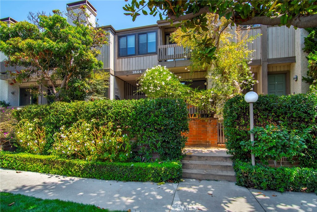 Step into this beautifully renovated, urban-modern townhouse with its own private entrance—perfectly positioned within walking distance to Century City and Westwood Village (UCLA). Tucked away in a quiet, secure 14-unit community with a swimming pool, this spacious 3-bedroom, 2.5-bath residence offers approximately 1,500 sq. ft. of open floor plan living space. Inside, the split-level layout features a fully custom European kitchen with Natural Quartzite countertops, overlooking a dining area that flows into a sunlit living room with a fireplace and charming front porch. Upstairs, the primary suite boasts a private balcony, soaring cathedral ceiling, dual walk-in closets, and a luxurious en suite bath with a double-sink vanity. The second floor also hosts two additional bedrooms—one with a walk-in closet—sharing a sleek, updated 3/4 bath, plus a convenient laundry area with washer and dryer included. Modern upgrades throughout include custom designer lighting, smart-home technology (Ring security, Yale keyless entry, Nest thermostat), and a high-speed mesh network—perfect for today’s active, connected lifestyle. Located in the highly sought-after Westwood Charter School district. Enjoy the convenience of two side-by-side secure parking spaces with car charger, proximity to the Metro Rail, and a thoughtful floor plan designed for comfort and functionality. The first floor is framed by private front and rear patios, creating the ideal indoor-outdoor lifestyle.