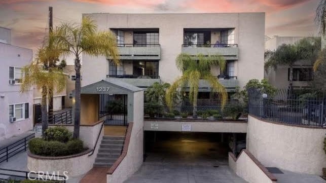 Updated photos coming soon! Located in the "Executive Terrace", a gated community in beautiful Long Beach, this upgraded 2-bedroom, 1-bath end-unit condo offers comfort, style, in-unit laundry, 2 parking spaces, and smart living. Step inside to find newer waterproof luxury vinyl flooring throughout, baseboards, and fresh paint for a clean, modern feel.
The kitchen has been thoughtfully updated with shaker cabinets, quartz countertops, recessed lighting, and a stainless steel LG refrigerator. Your newer Samsung range with built-in air fryer, smart features, and self-cleaning function, comes with a matching Samsung microwave. There is also a dishwasher for your convenience. Complete with an in-unit laundry center where you will find a full-size washer and dryer!
Both bedrooms feature custom closet organizers. The spacious primary bedroom gets a lot of natural light, fits a king size bed and connects directly to the Jack-and-Jill style bathroom, offering private access for both bedrooms. The bathroom includes a custom-height vanity with a quartz countertop, an LED mirror, and a new custom-height toilet.
Enjoy a private balcony off the living room with views of 6th Street and the community spa area. Stay comfortable year-round with central A/C controlled by a Google Nest smart thermostat, and don't forget about the gas fireplace in the living room for those cozy nights.
Tired of taking the stairs? This community has an elevator that takes you down to you two covered parking spaces in a gated garage with added storage space, and a bike rack. The HOA covers the cost of your water and trash. Recent HOA upgrades include a newer roof from 2024, already paid for by the seller; a huge value! Pets are also welcomed!
Located just blocks from Retro Row, Downtown Long Beach, the beach, biking paths, Museum of Latin American Art, and the East Village Arts District, restaurants, bars, coffee shops, and so much more!. Be sure to schedule your showing today.
